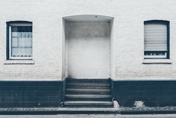 close up photo of white and black concrete building's entrance