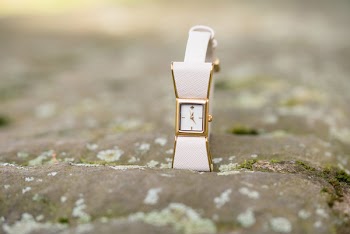 Close-Up Photo of White And Gold Wristwatch