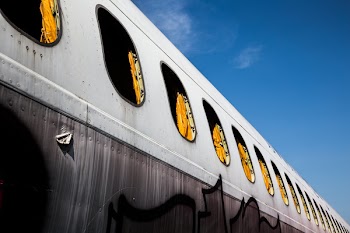 Close-up Photo of White Plane With Curtains Inside