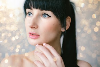 Close-Up Photo of Woman's Face