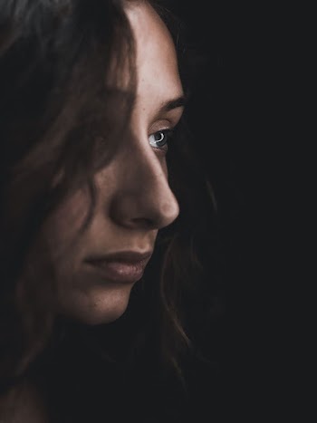 Close-up Photo of Woman Facing Sideways
