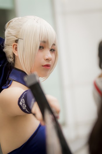 Close-Up Photo Of Woman Holding A Sword
