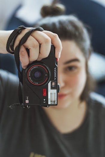 Close-Up Photo of Woman Holding Camera