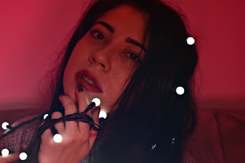 Close-Up Photo of Woman Holding Fairy Lights
