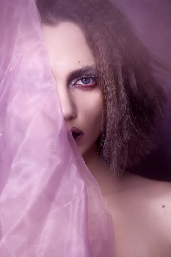 Close-Up Photo of Woman Holding Textile
