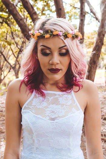 Close-up Photo of Woman in Flower Crown and White Lace Top