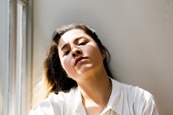 Close-Up Photo of Woman in White Collared Top