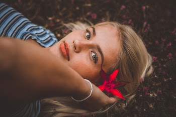 Close-Up Photo of Woman Laying On Ground