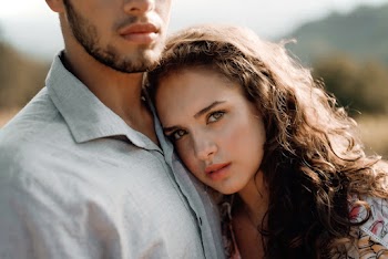 Close-up Photo of Woman Leaning on Man's Chest