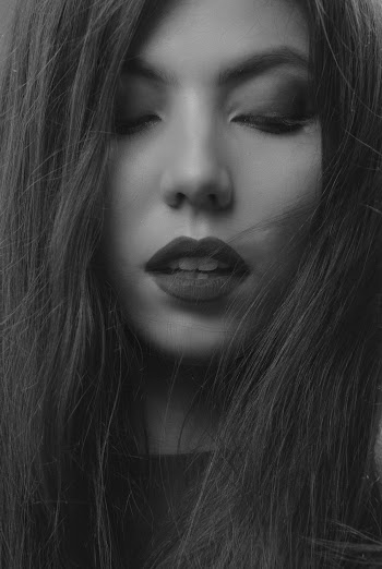 Close-up Photo of Woman Looking Down