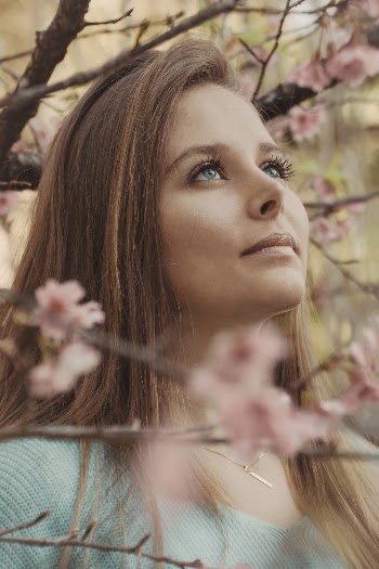 Close-Up Photo of Woman Looking Up