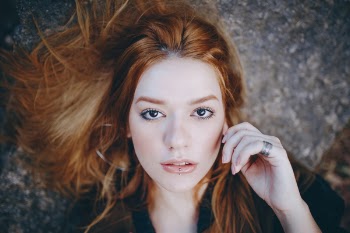 Close-up Photo of Woman Lying Down