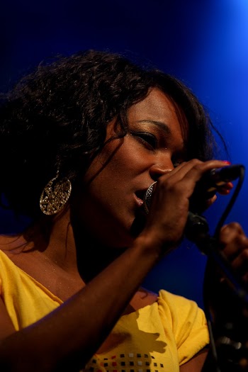Close-Up Photo of Woman Singing