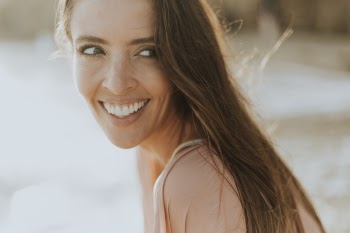 Close-Up Photo of Woman Smiling