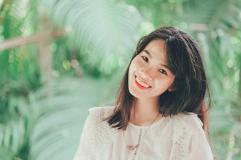 Close-Up Photo of Woman Smiling