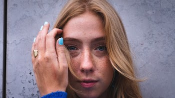 Close-Up Photo Of Woman Touching Her Hair