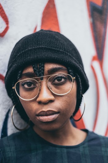 Close-Up Photo Of Woman Wearing A Beanie And Eyeglasses