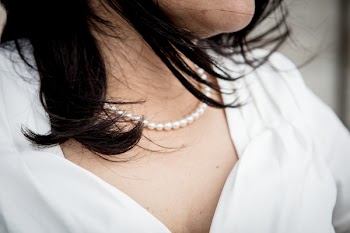 Close-up Photo Of Woman Wearing Beaded White Pearl Necklace