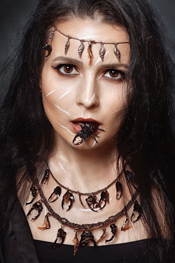Close-Up Photo of Woman Wearing Beetle Horn Necklace