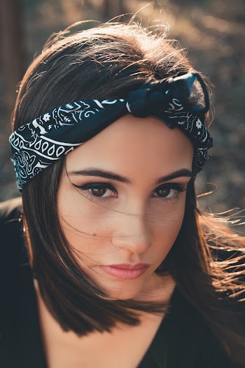 Close-Up Photo of Woman Wearing Black Bandana