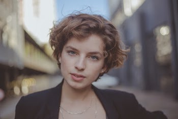 Close-Up Photo of Woman Wearing Black Blazer