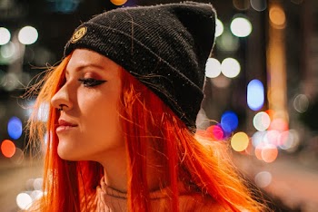 Close-Up Photo of Woman Wearing Black Bonnet