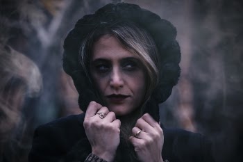 Close-Up Photo of Woman Wearing Black Hood