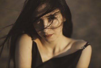 Close-Up Photo Of Woman Wearing Black Tank Top