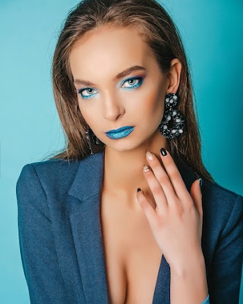 Close-Up Photo of Woman Wearing Blue Blazer