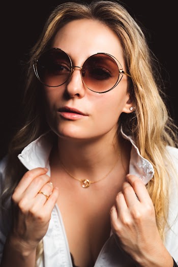 Close-Up Photo Of Woman Wearing Brown Sunglasses