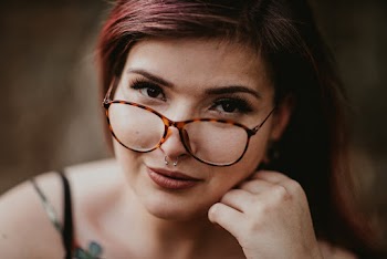 Close-Up Photo Of Woman Wearing Eyeglasses