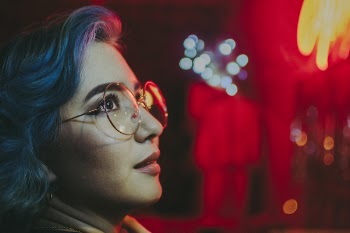 Close-Up Photo of Woman Wearing Eyeglasses