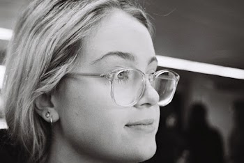 Close-Up Photo of Woman Wearing Eyeglasses