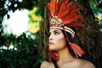 Close-Up Photo of Woman Wearing Feather Headdress