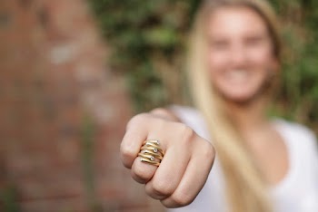 Close-Up Photo of Woman Wearing Golden Ring
