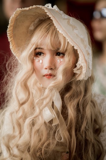 Close-Up Photo Of Woman Wearing Hat