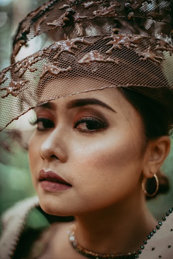 Close-Up Photo of Woman Wearing Headdress