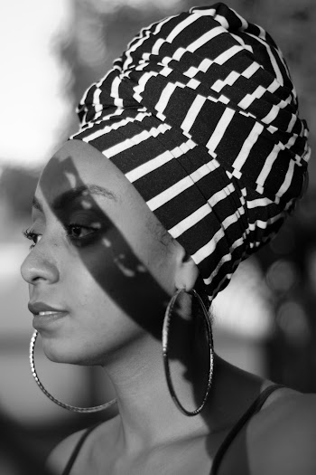Close-Up Photo Of Woman Wearing Headwear