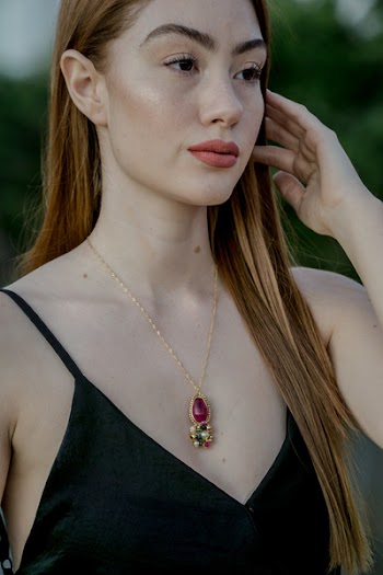 Close-Up Photo of Woman Wearing Necklace