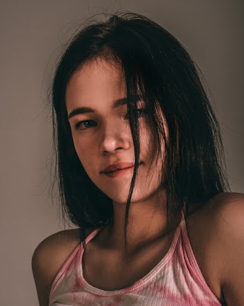Close-Up Photo of Woman Wearing Pink Top