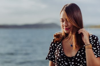 Close-Up Photo Of Woman Wearing Polka-Dots Dress