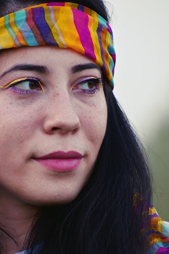 Close-up Photo of Woman Wearing Purple Eyeliner