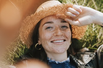 Close-Up Photo of Woman Wearing Straw Hat