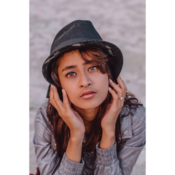 Close-Up Photo Of Woman Wearing Sun Hat
