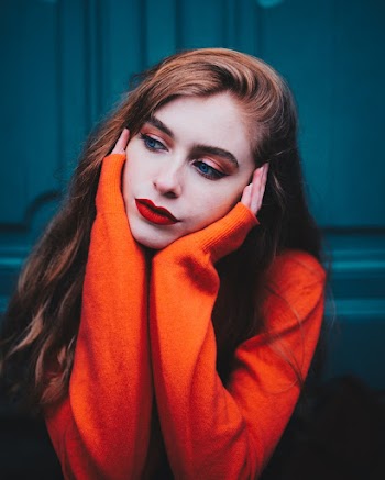 Close-Up Photo of Woman Wearing Sweater
