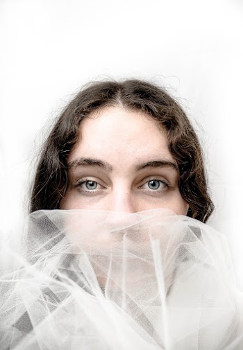 Close-Up Photo Of Woman Wearing White Veil
