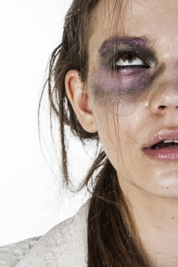 Close-Up Photo of Woman With Black and Purple Eye Shadow