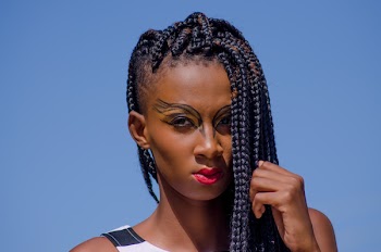 Close-Up Photo of Woman With Braided Hair