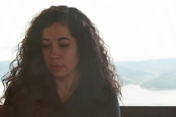 Close-Up Photo of Woman With Curly Hair