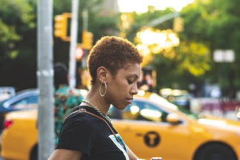 Close-Up Photo of Woman With Curly Hair